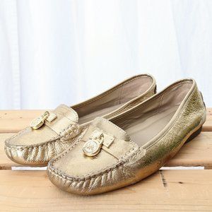 Gold Michael Kors loafers with coin
